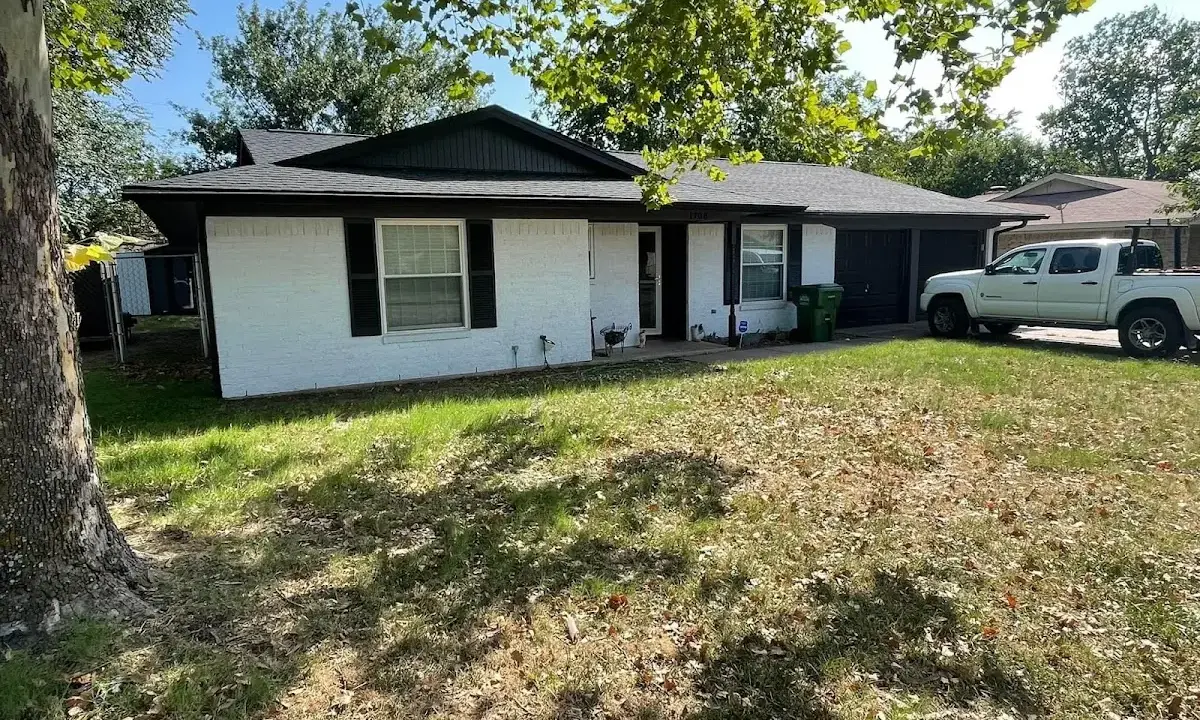 Professional roofing crew working on a residential roof in Pleasantville
